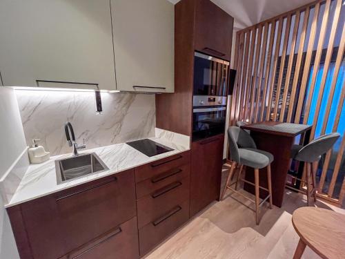 a kitchen with a sink and a counter top at La Quinta del Sordo in Luarca