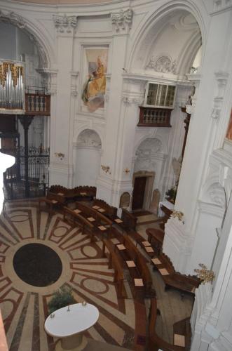 a large room with a spiral staircase in a building at Gästehaus im Priesterseminar Salzburg in Salzburg