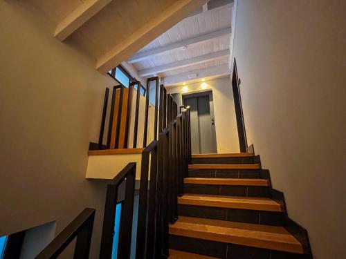 a stairway with a bunch of pipes in a building at La Quinta del Sordo in Luarca