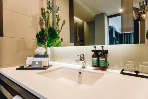 a bathroom with a sink and a mirror at Crowne Plaza Belgrade by IHG in Belgrade