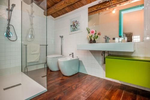 a bathroom with a shower and a sink and a toilet at VILLA RAMUNNA 6, Emma Villas in Rosolini
