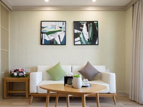 Χώρος καθιστικού στο The Q Hotel & Suite Vientiane 万象Q套房酒店