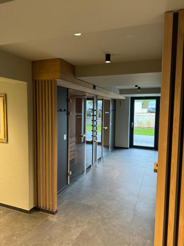 an empty hallway with glass doors in a building at Privat-Hotel Villa Aurora in Bad Neuenahr-Ahrweiler