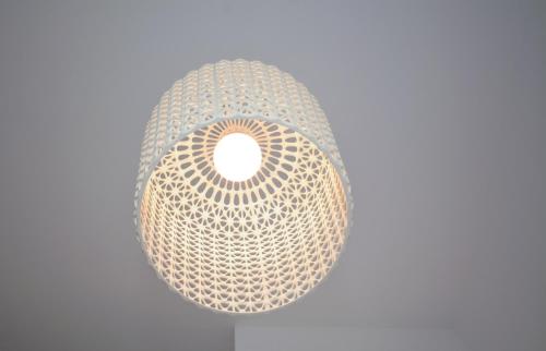 a light fixture hanging from a ceiling at Hotel Miramare in Otranto