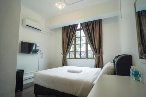Postel nebo postele na pokoji v ubytování B Link Hotel