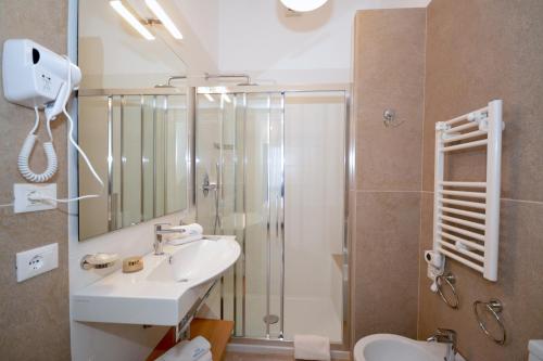 a bathroom with a sink and a shower at Hotel Miramare in Otranto