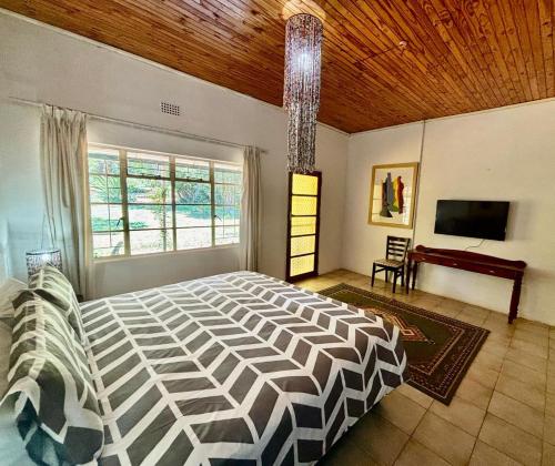 Ένα ή περισσότερα κρεβάτια σε δωμάτιο στο The Seed Pod Guesthouse