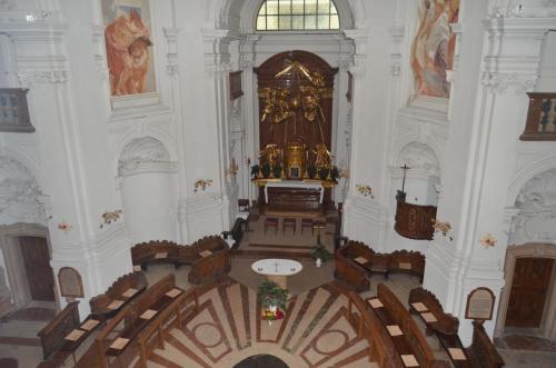 an aerial view of a church with a altar and chairs at Gästehaus im Priesterseminar Salzburg in Salzburg