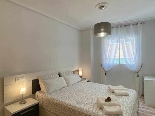 Postel nebo postele na pokoji v ubytování Acogedor apartamento a 200 m de la playa