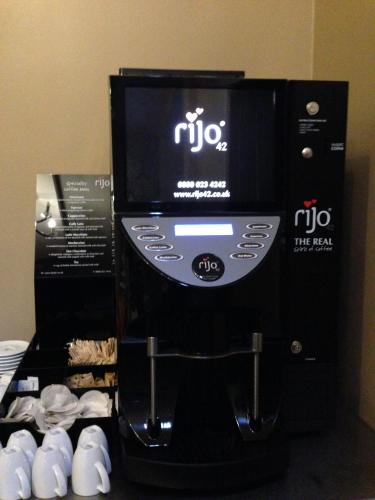 a black coffee maker is on display in a room at Grainger Hotel in Newcastle upon Tyne