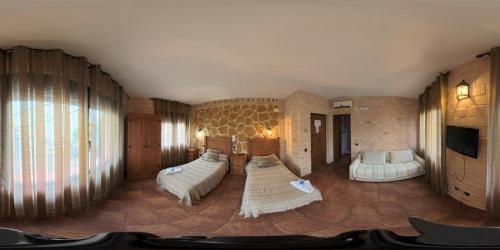 A bed or beds in a room at Posada de los Cónsules