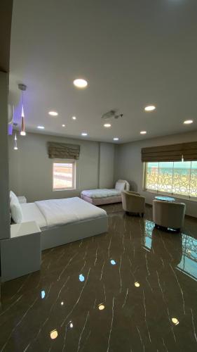 a bedroom with a bed and a glass floor at Marina in Sohar