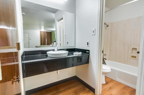 a bathroom with a sink and a toilet at Motel 6-Longview, TX - North in Longview