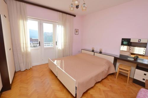 Postel nebo postele na pokoji v ubytování Apartments Marija