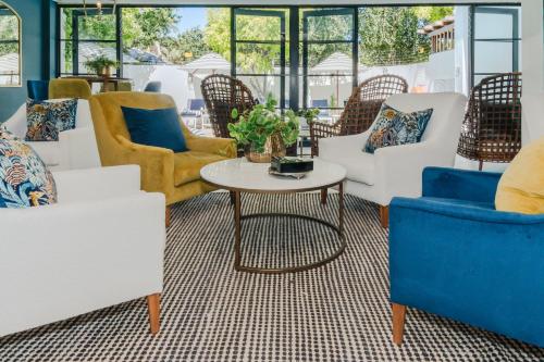 a living room with chairs and a table at Last Word Franschhoek in Franschhoek