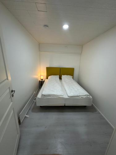 a bedroom with a bed in a white room at Greek house in Salo