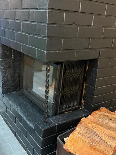 a model of a brick building with a fireplace at Greek house in Salo
