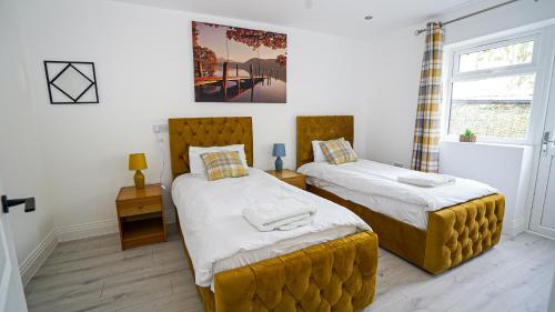Ένα ή περισσότερα κρεβάτια σε δωμάτιο στο Easy 2 Manage 4Bedroom House with Complimentary Parking