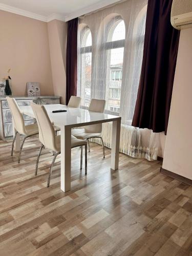a dining room with a table and chairs at Hotel Oppium Restaurant & Garden in Ruse