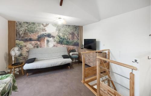 a living room with a couch and a television at Beautiful Apartment With Wifi in Pornic