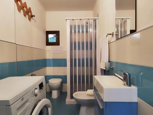 a bathroom with a sink and a toilet and a shower at Baia delle Sirene by Holiday World in Porticello