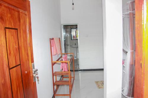 a room with a painting and a wooden ladder at Calm Nature Resort in Midigama
