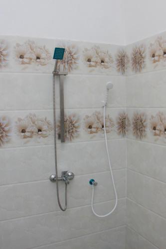 a bathroom with a shower with a shower head at Calm Nature Resort in Midigama
