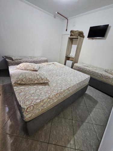 Katil atau katil-katil dalam bilik di Hotel Mão de Fatima