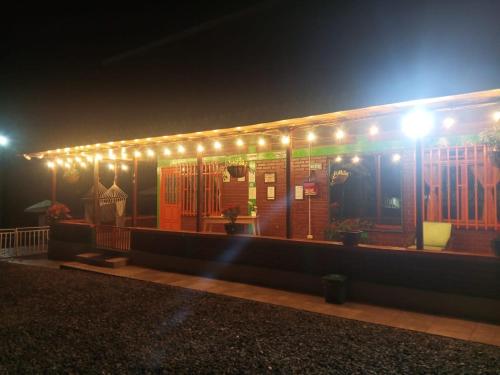 a lit up building with lights on it at night at Finca La Gaviota in Montenegro