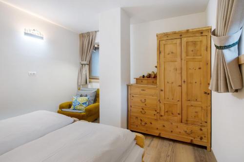 Ένα ή περισσότερα κρεβάτια σε δωμάτιο στο Chalet Pieri - Appartamento Temelin