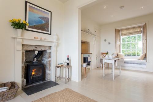 Posezení v ubytování Romantic cottage with fantastic coastal views