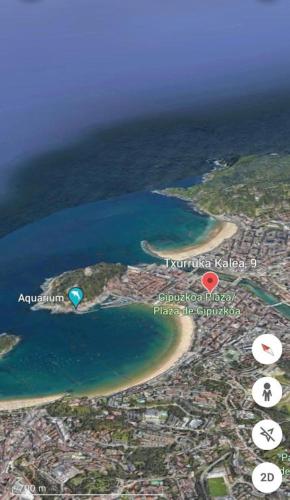 an aerial view of a beach and the ocean at APARTAMENTO MENTURA Centro de San Sebastian Parking FREE in Donostia-San Sebastián