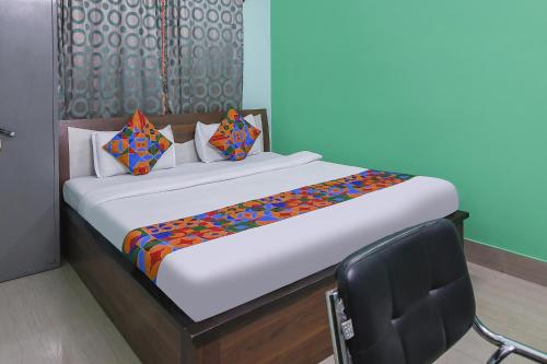 Ένα ή περισσότερα κρεβάτια σε δωμάτιο στο FabHotel Vicky