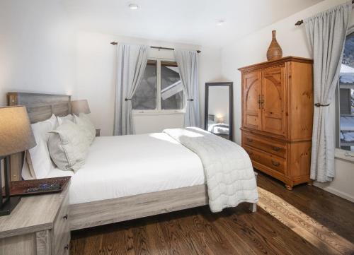 a bedroom with a bed and a dresser and a window at 5025 Main Gore Place Condo in Vail