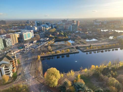 an aerial view of a city with a river at Media City Salford Quays Flat by City SuperHost in Manchester