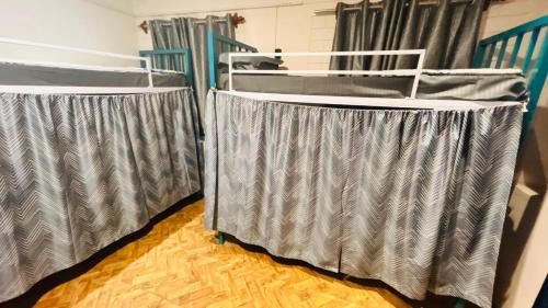 a pair of bunk beds in a room at Garden Aroma Palolem, Beachside Hostel & Cafe Bar in Palolem