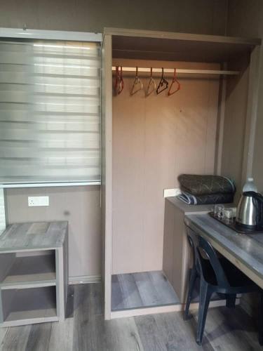 a kitchen with a counter and a table in a room at D'semporna Homestay in Semporna