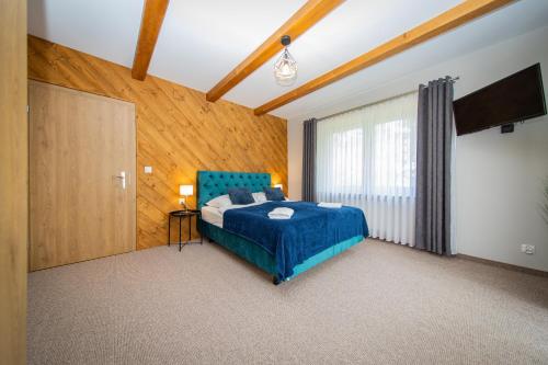 Postel nebo postele na pokoji v ubytování River ApartHouse Zakopane