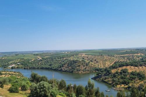 an aerial view of a river with boats in it at AviStar by Portus Alacer in Avis