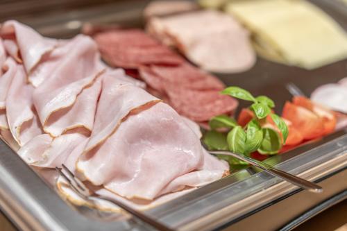 a tray of food with meat and meats and cheese at Haus Gstrein in Obergurgl