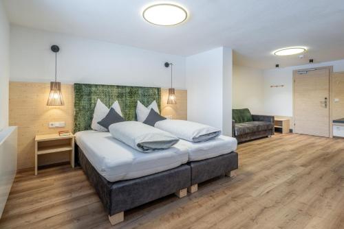 Postel nebo postele na pokoji v ubytování Haus Gstrein