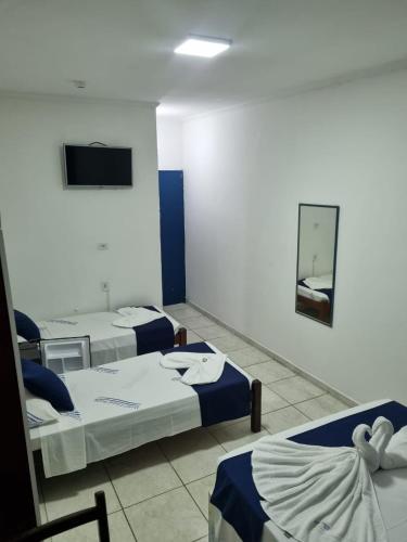 Ένα ή περισσότερα κρεβάτια σε δωμάτιο στο Hotel Litoral Norte
