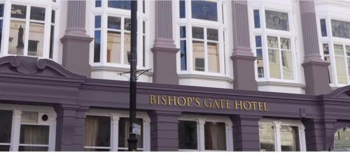 a building with a sign that reads histories gate hotel at Bishop's Gate Hotel in Derry Londonderry
