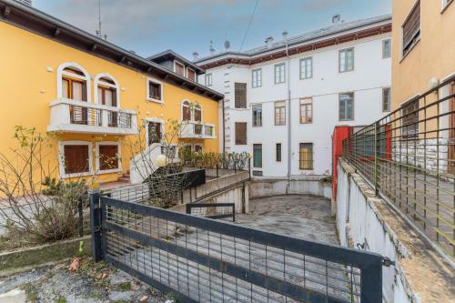 a row of buildings with yellow and white at Fuori da ZTL - Asiago a due passi da tutto in Asiago