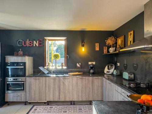 a kitchen with a sink and a counter top at Maison de campagne, deux chambres, vue sur les montagnes in Sartène