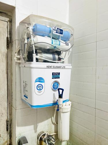 a water heater on the wall of a room at Vivanta Home Stay in Ayodhya