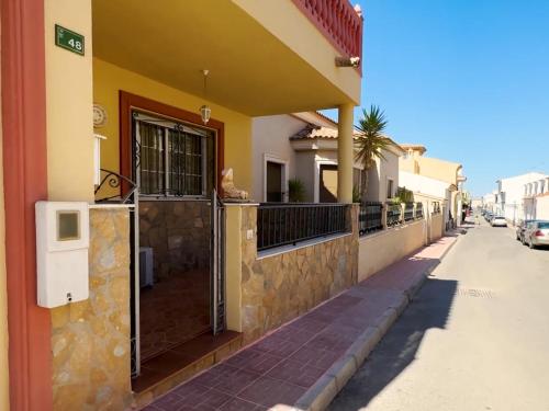 a building with a gate on the side of a street at Exclusive Apartments with Panoramic Views and Unique Interiors in Los Gallardos