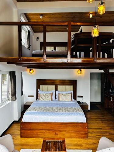 a bedroom with two bunk beds in a house at Queens Lake Cabin in Nuwara Eliya