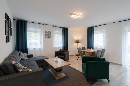 a living room with a couch and a table at Domus Optima - Cozy Retreat in Vienna in Vienna