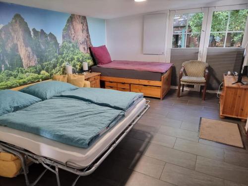 a hospital room with a bed and a chair at Haus Wallapampa im Grünen entspannen in Landscheide